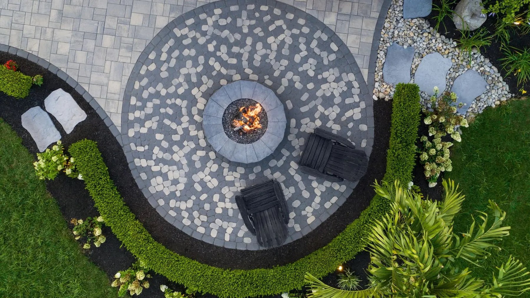 Custom paver fire pit and landscaping