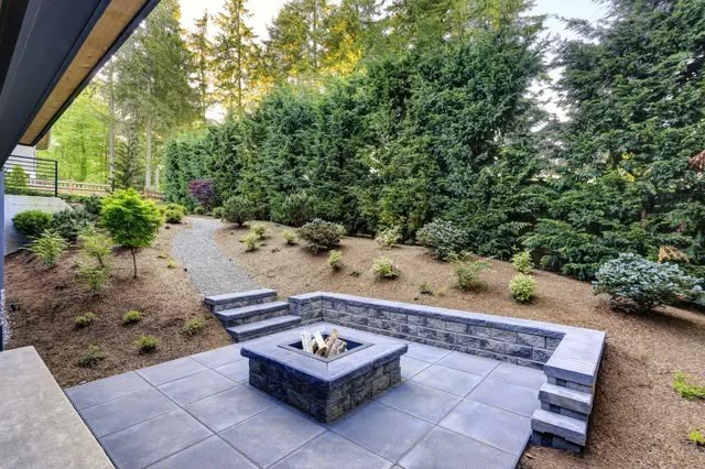 Fire pit patio with retaining wall seating